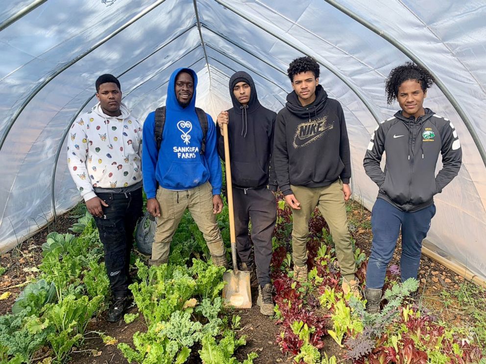 PHOTO: Kamal Bell, a doctoral student and founder of Sankofa Farms in Cedar Grove, North Carolina, poses alongside his students Yakir Lee, Kamal Bell Kamron Jackson, Mikal Ali and Jamil Ali.