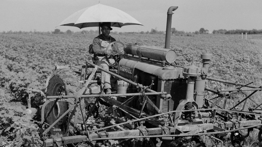 PHOTO: A day laborer rides a tractor in a farm in Clarksdale, Miss., Aug. 1940.