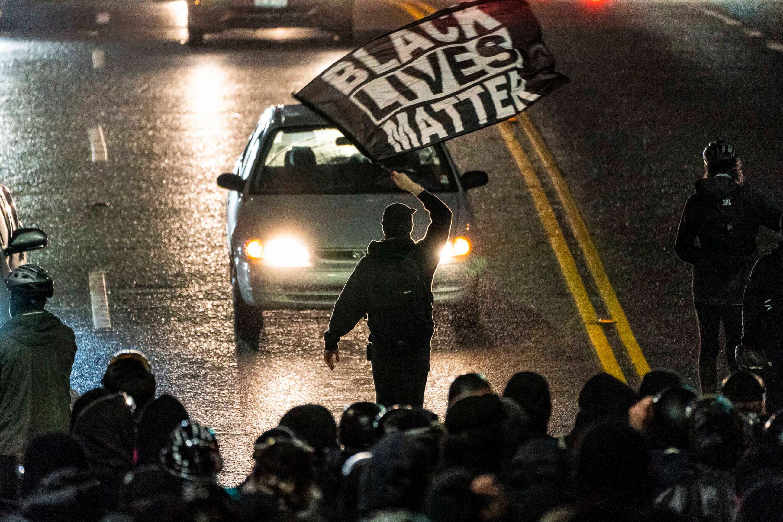 PHOTO: A protester waves a Black Lives Matter flag during racial justice protests, Nov. 3, 2020, in Seattle.