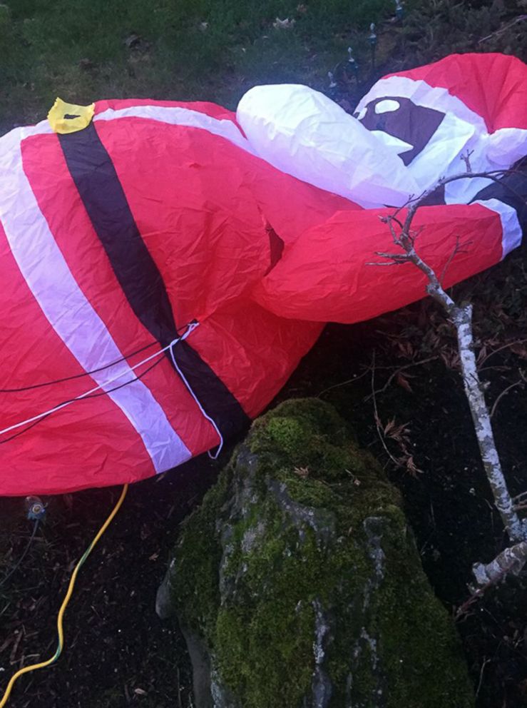 PHOTO: The Richard's black Santa sits deflated in their front yard in Bethany, Ore., Dec. 13, 2018.