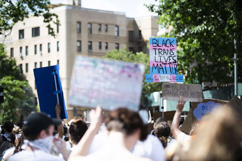 PHOTO: Protestors march with chants, flags, sign and white clothing in support of Black Trans Lives Matter on June 14, 2020, in the Brooklyn borough of New York City. 
