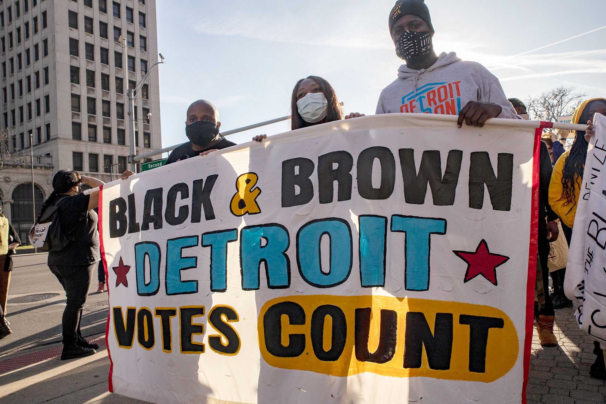 PHOTO: Demonstrators hold a banner that says Black and Brown Votes Count, during a protest in Detroit, Nov. 7, 2020.
