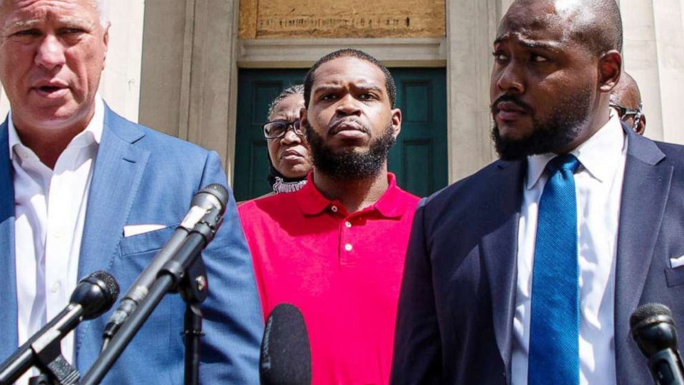 PHOTO: Kenneth Walker, center, the boyfriend of the late Breonna Taylor, stands alongside his mother and attorneys during a press conference in Louisville, Ky., Sept. 1, 2020.