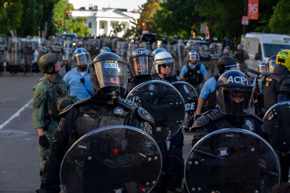 PHOTO: The White House is seen behind a line of police officers wearing riot gear as they push back demonstrators on June 1, 2020, in Washington D.C., during a protest over the death of George Floyd.