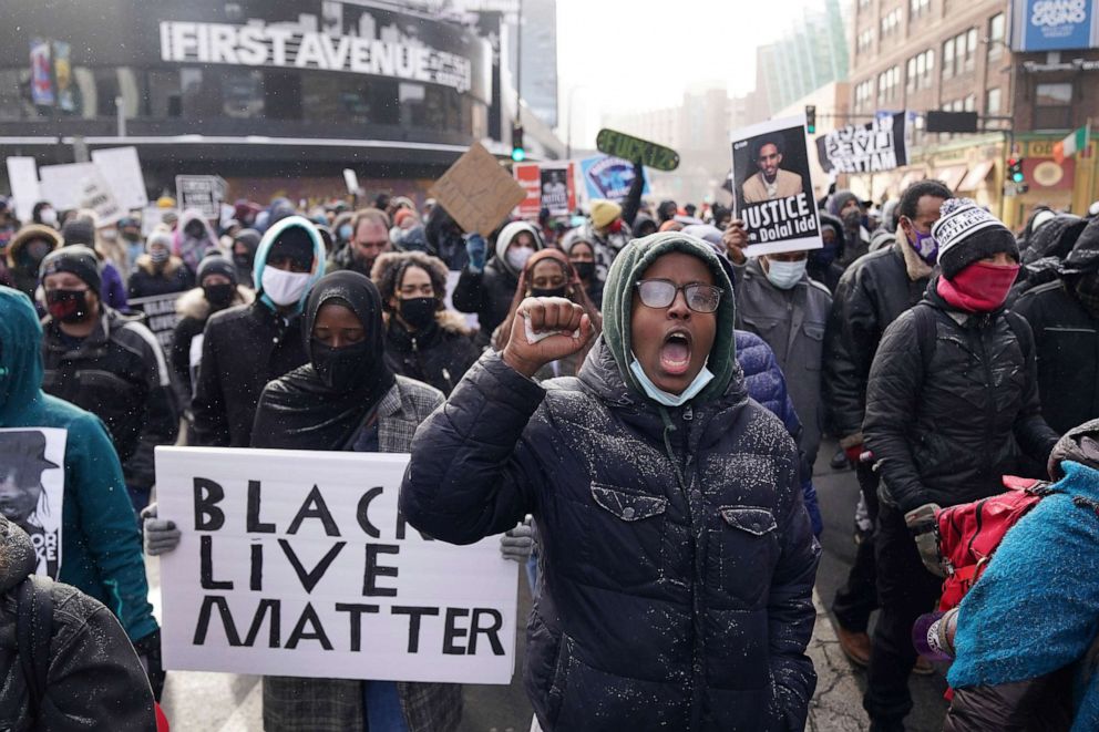 PHOTO: Black Lives Matter protesters march down the middle of 3rd Avenue South in Minneapolis, Minnesota, on Jan. 9, 2021, to demand justice for Jacob Blake, who was shot by police and left partially paralyzed in Kenosha, Wisconsin.