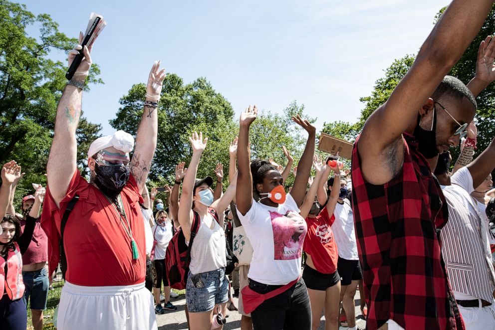 PHOTO: Jonovia Chase, center, honors native land in an opening ceremony led by Graciela Tibiaquira at the Juneteenth Jubilee.