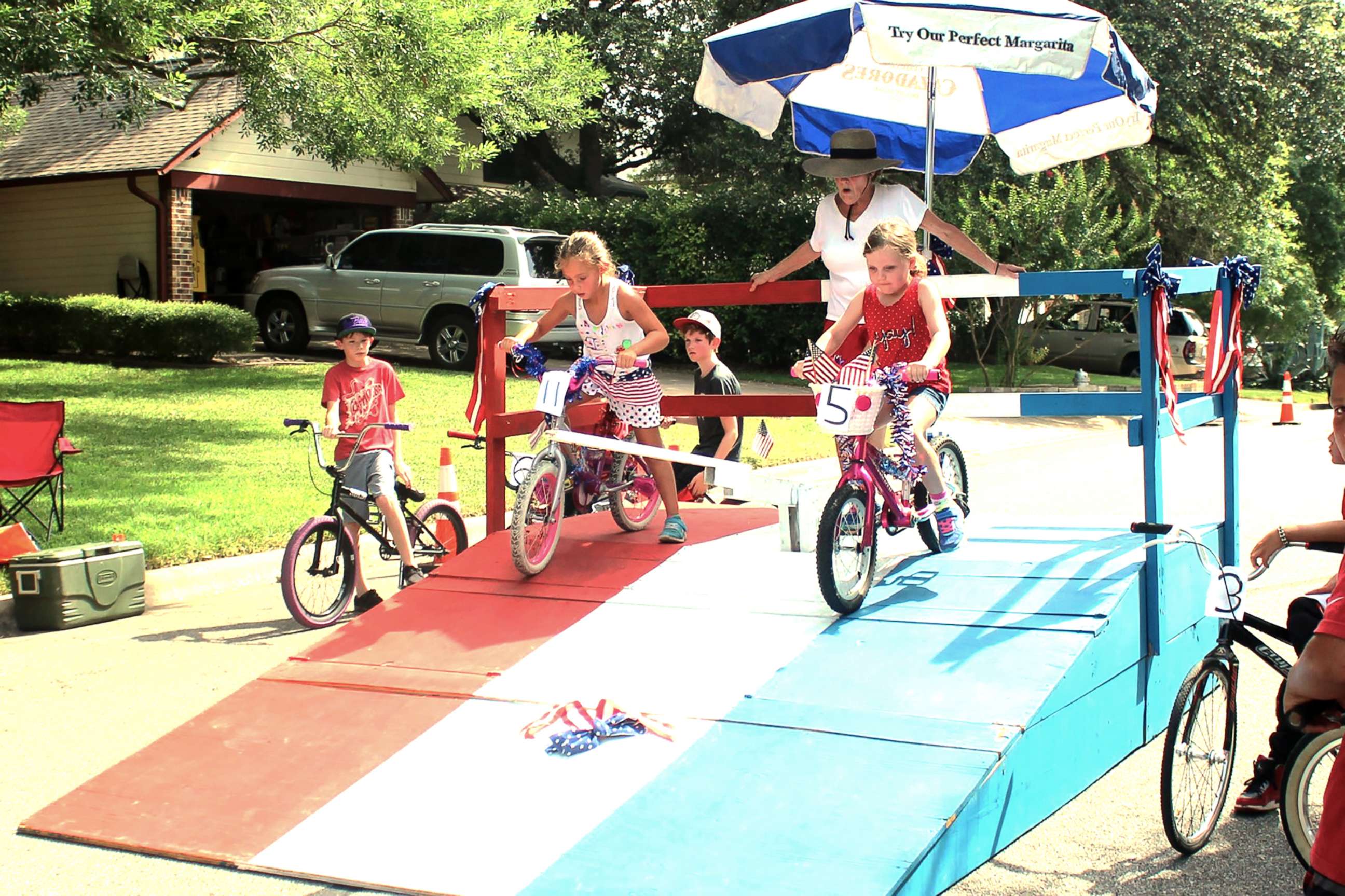 PHOTO: Residents of Riverton Drive in Austin, Texas, participate in a bike race during one of their annual block parties. 