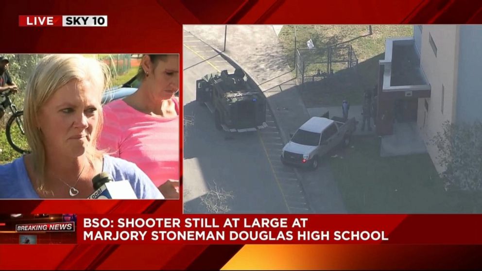 PHOTO: A woman said that her 9th-grade daughter was in the auditorium after reports of a shooting at Stoneman Douglas High School in Parkland, Fla., Feb. 14, 2018.