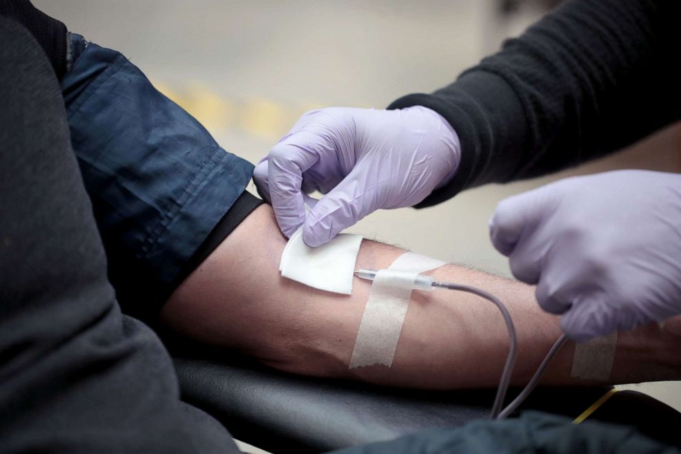 PHOTO: A volunteer donates blood at the Field Museum of Natural History during an American Red Cross blood drive, May 11, 2020, in Chicago.