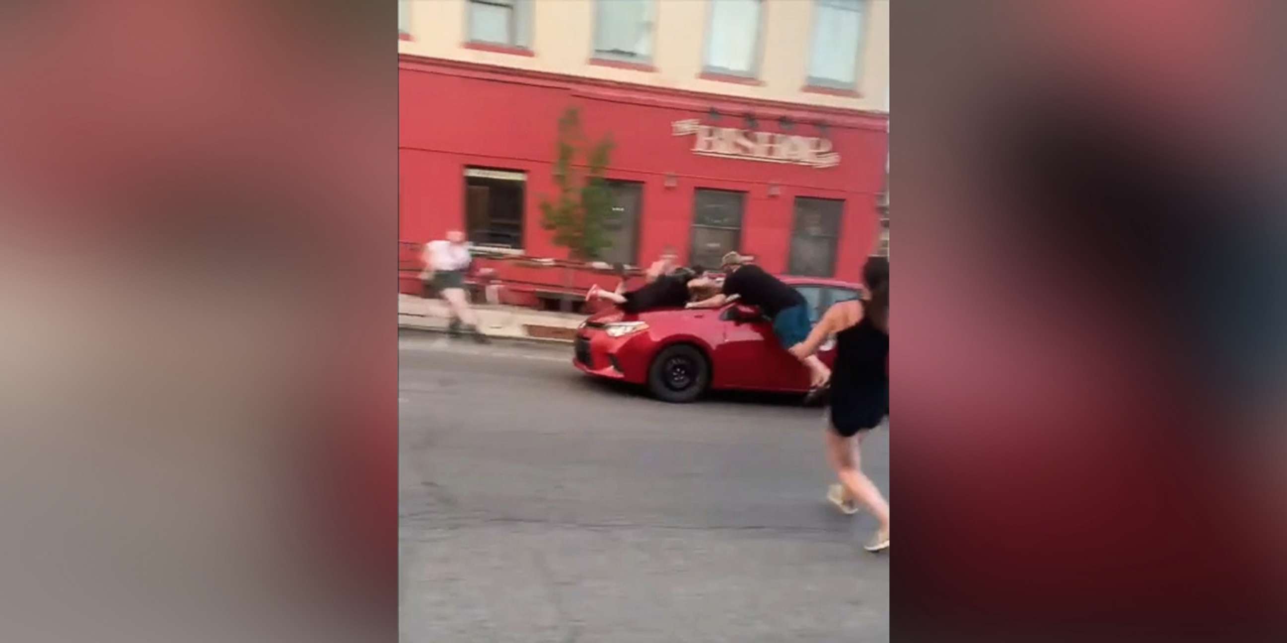 PHOTO: Two protesters are struck by car which sped through the crowd in Bloomington, Ind., July 6, 2020.