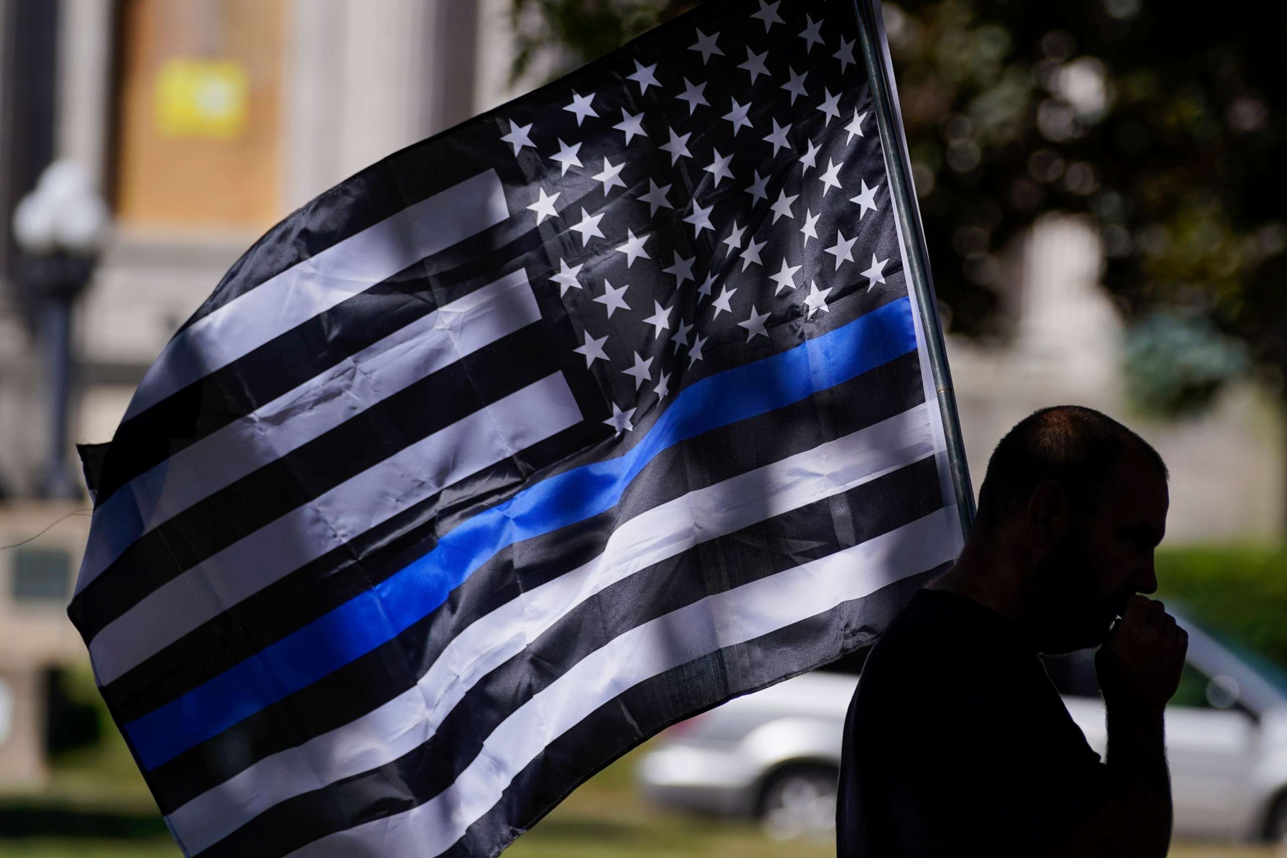 PHOTO: An unidentified man participates in a Blue Lives Matter rally Sunday, Aug. 30, 2020, in Kenosha, Wis.