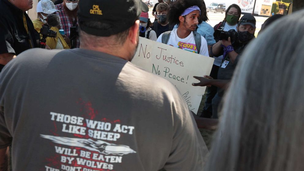 PHOTO: Stan Easley (C) speaks to a group of demonstrators holding a Back the Blue Rally in front of the Kenosha County Courthouse on August 30, 2020 in Kenosha, Wisconsin. 