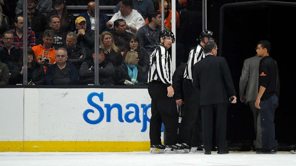 PHOTO: Officials leave the ice after the game between the Anaheim Ducks and the St. Louis Blues was postponed following a medical emergency involving Blues defenseman Jay Bouwmeester during the first period of an NHL hockey game.