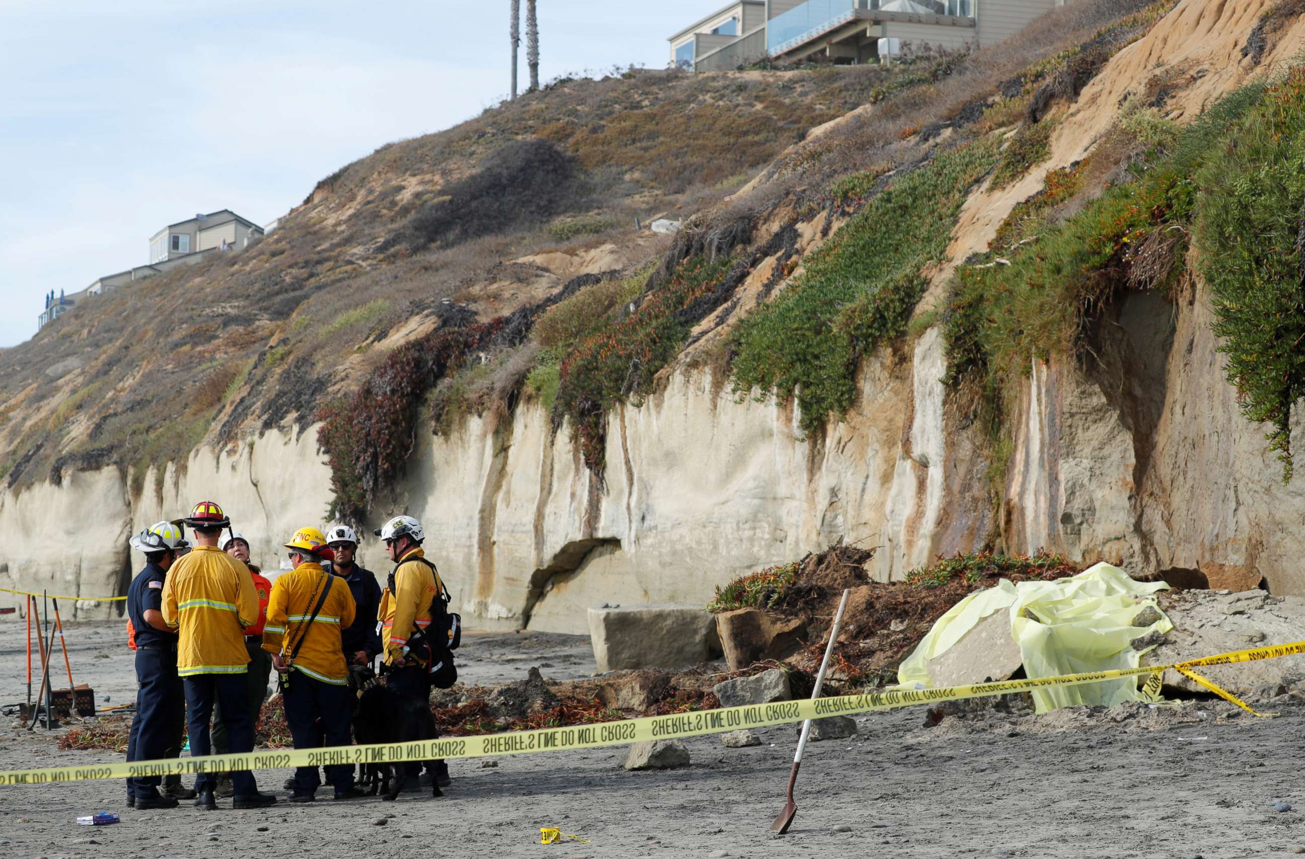 PHOTO: Emergency responders attend to a cliff collapse at a beach in Encinitas, Calif., on Friday, Aug. 2, 2019.