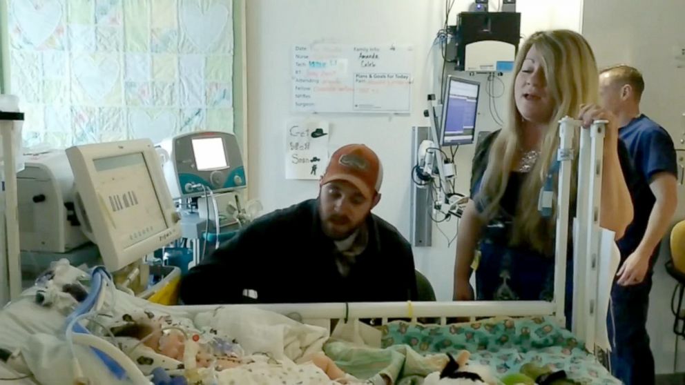 PHOTO: Amanda Bowman Gray and husband Caleb Gray sing to Bo Gray after he had surgery. She said the two sang "You Are My Sunshine" to him before and after his procedure. She said it was now his theme song. 