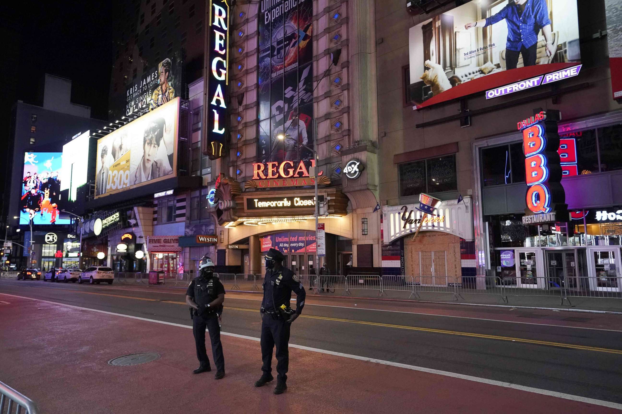 PHOTO: New York City Police Department (NYPD) patrols closed off Times Square shorty before the 11 p.m. curfew went into effect, June 1, 2020, as demonstrators rallied across the five boroughs after George Floyd died in police custody on May 25.