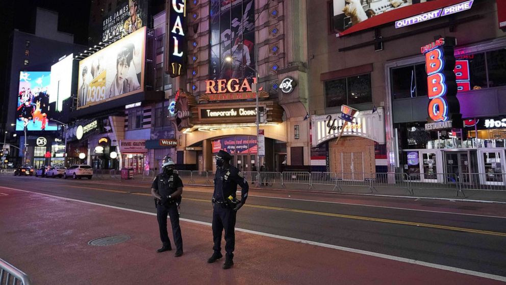 PHOTO: New York City Police Department (NYPD) patrols closed off Times Square shorty before the 11 p.m. curfew went into effect, June 1, 2020, as demonstrators rallied across the five boroughs after George Floyd died in police custody on May 25.