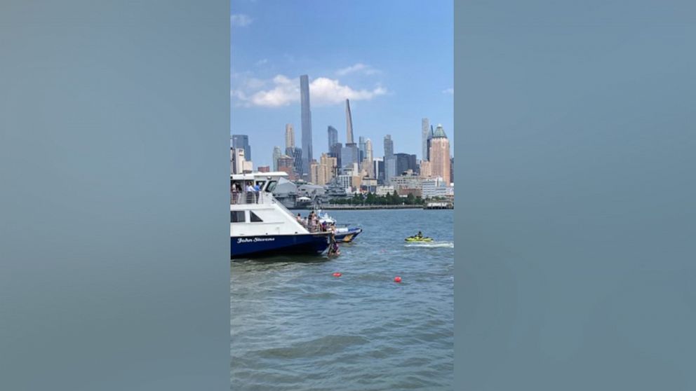 PHOTO: People are rescued after a boat overturned on the Hudson River on July 12, 2022.