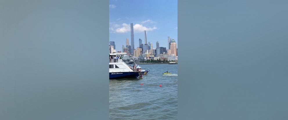 PHOTO: People are rescued after a boat overturned on the Hudson River on July 12, 2022.