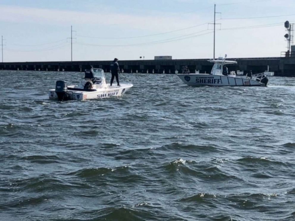 PHOTO: Police work the scene of a boat crash on Lake Pontchartrain in Louisiana, March 7, 2021.