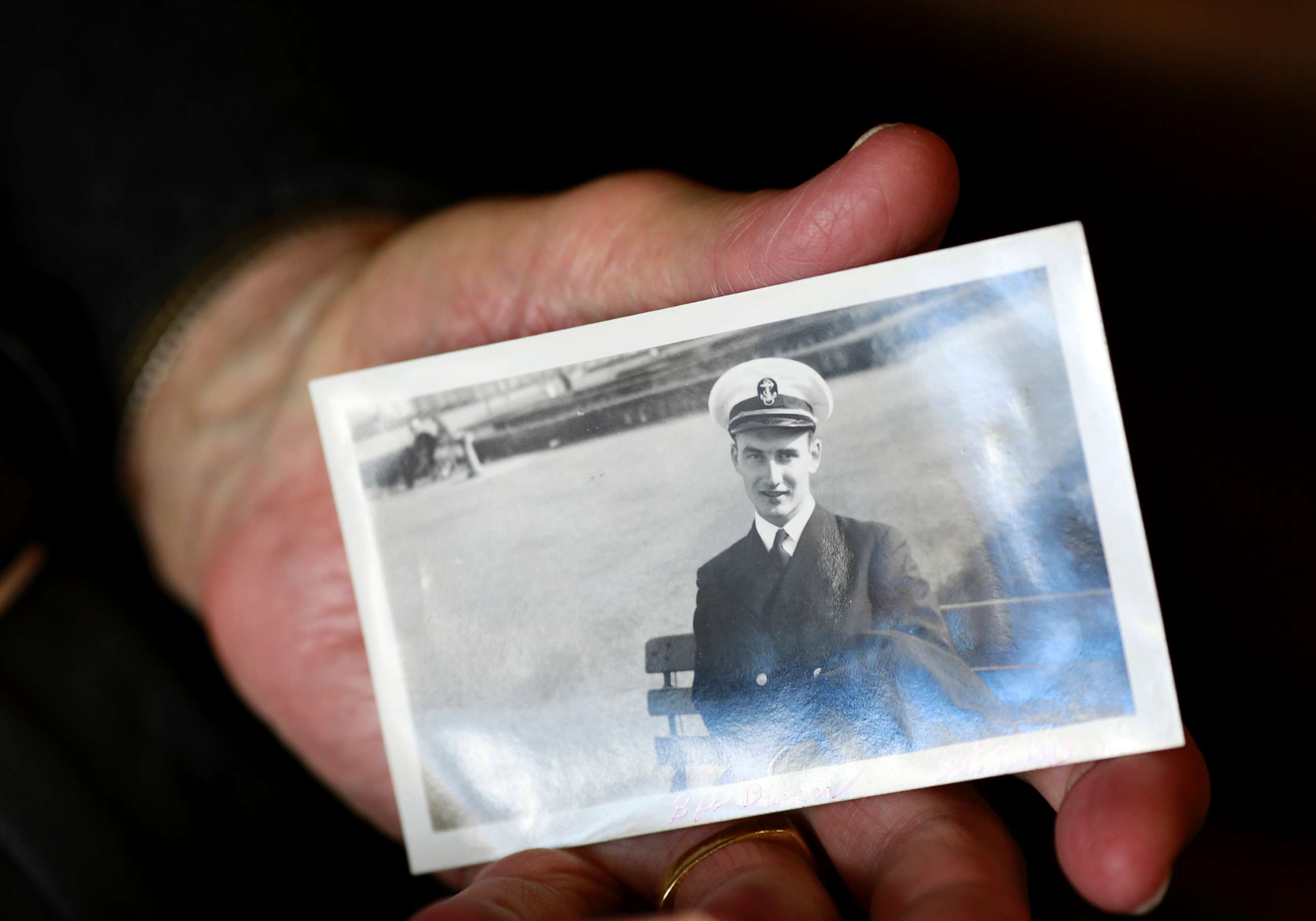 PHOTO: World War II veteran Bob Barger holds a photo of himself taken on Oct. 9, 1943, when he was serving in the U.S. Navy.