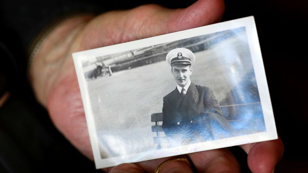 PHOTO: World War II veteran Bob Barger holds a photo of himself taken on Oct. 9, 1943, when he was serving in the U.S. Navy.