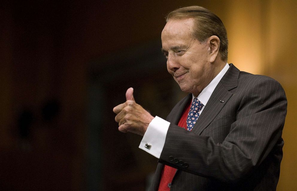 PHOTO: Former Senator Bob Dole gives retired US General Eric Shenseki a thumbs-up as he arrives for Shenseki's full committee hearing on his nomination to be Veterans Affairs Secretary on Capitol Hill in Washington, DC.