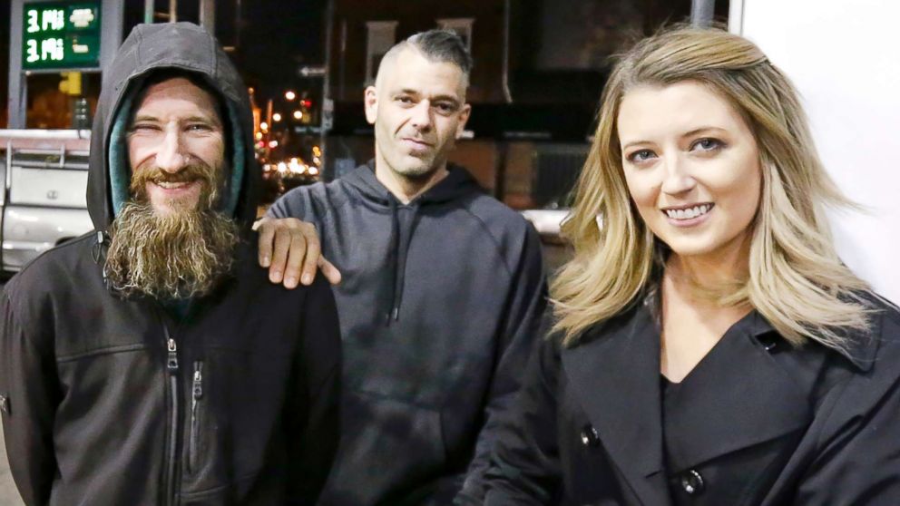 PHOTO: In this Nov. 17, 2017, file photo, Johnny Bobbitt Jr., left, Kate McClure, right, and McClure's boyfriend Mark D'Amico are pictured in Philadelphia.