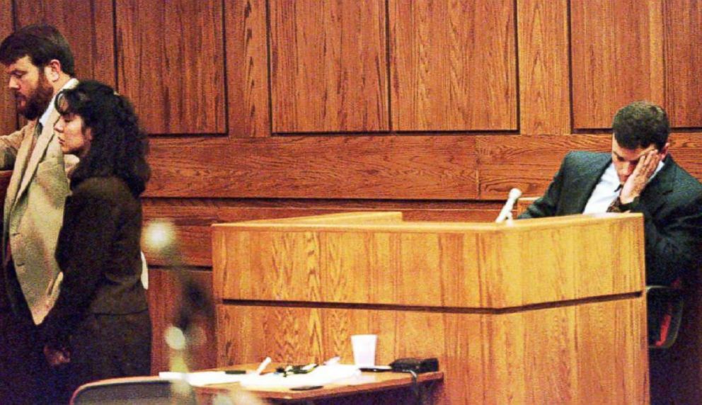 PHOTO: John Bobbitt waits while Lorena Bobbitt and her attorney talk with the judge during the second day of her trial, Jan. 11, 1994.