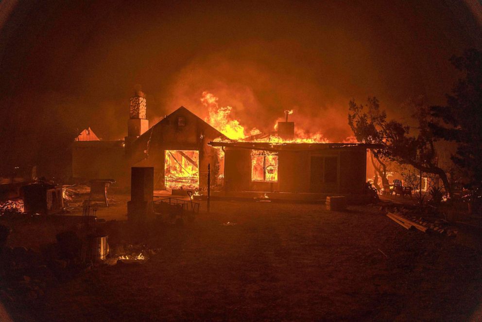 PHOTO: In this Sept. 18, 2020, file photo, a home burns during the Bobcat Fire in Juniper Hills, Calif.