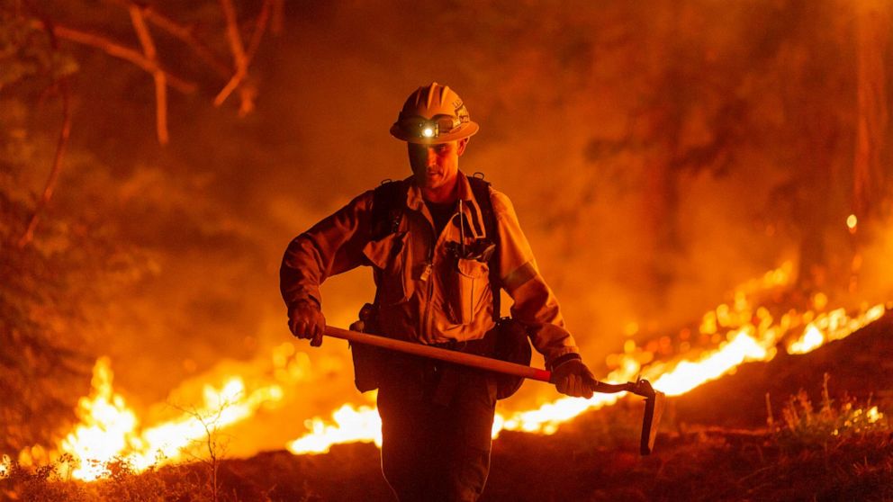 PHOTO: Los Angeles County firefighters, using only hand tools, keep fire from jumping a fire break at the Bobcat Fire in the Angeles National Forest on Sept. 11, 2020, north of Monrovia, Calif.
