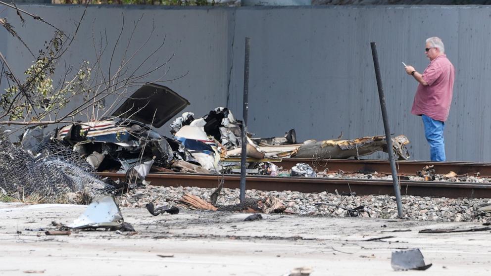 PHOTO: Emergency crew inspects the site of a small plane crash, April 11, 2025 in Boca Raton, Fla.