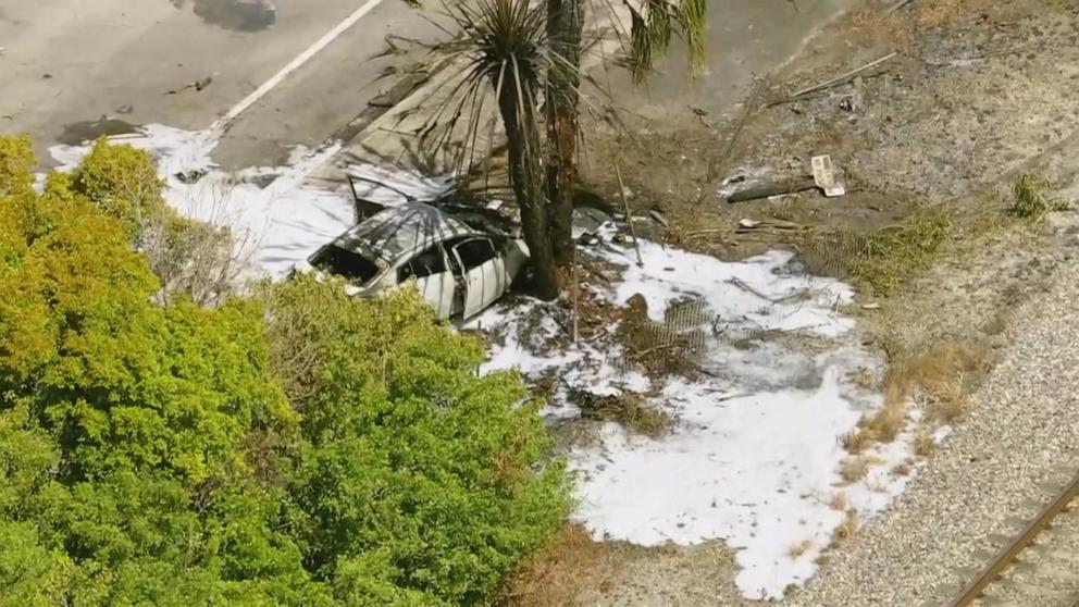 PHOTO: A car burns at the site of a crash in Boca Raton, Florida, April 11, 2025.