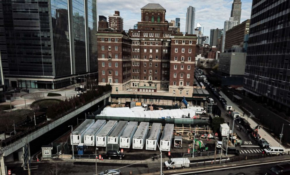 PHOTO: NYC building Makeshift morgue using 8 refrigerated trucks outside Bellevue Hospital in Manhattan to deal with a potential surge of coronavirus victims, March 27, 2020.