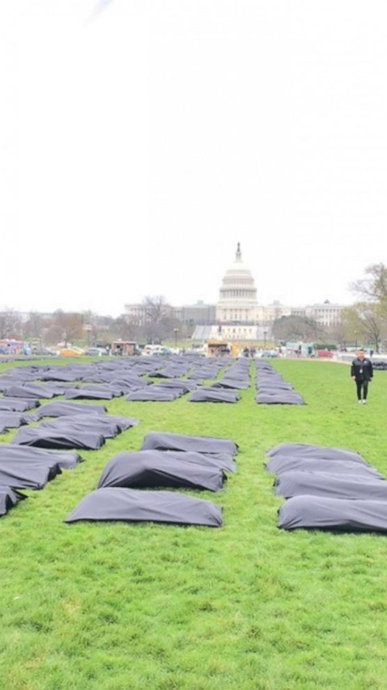 PHOTO: Symbolic body bags to mark gun violence deaths on the national mall in Washington, March 24, 2022.