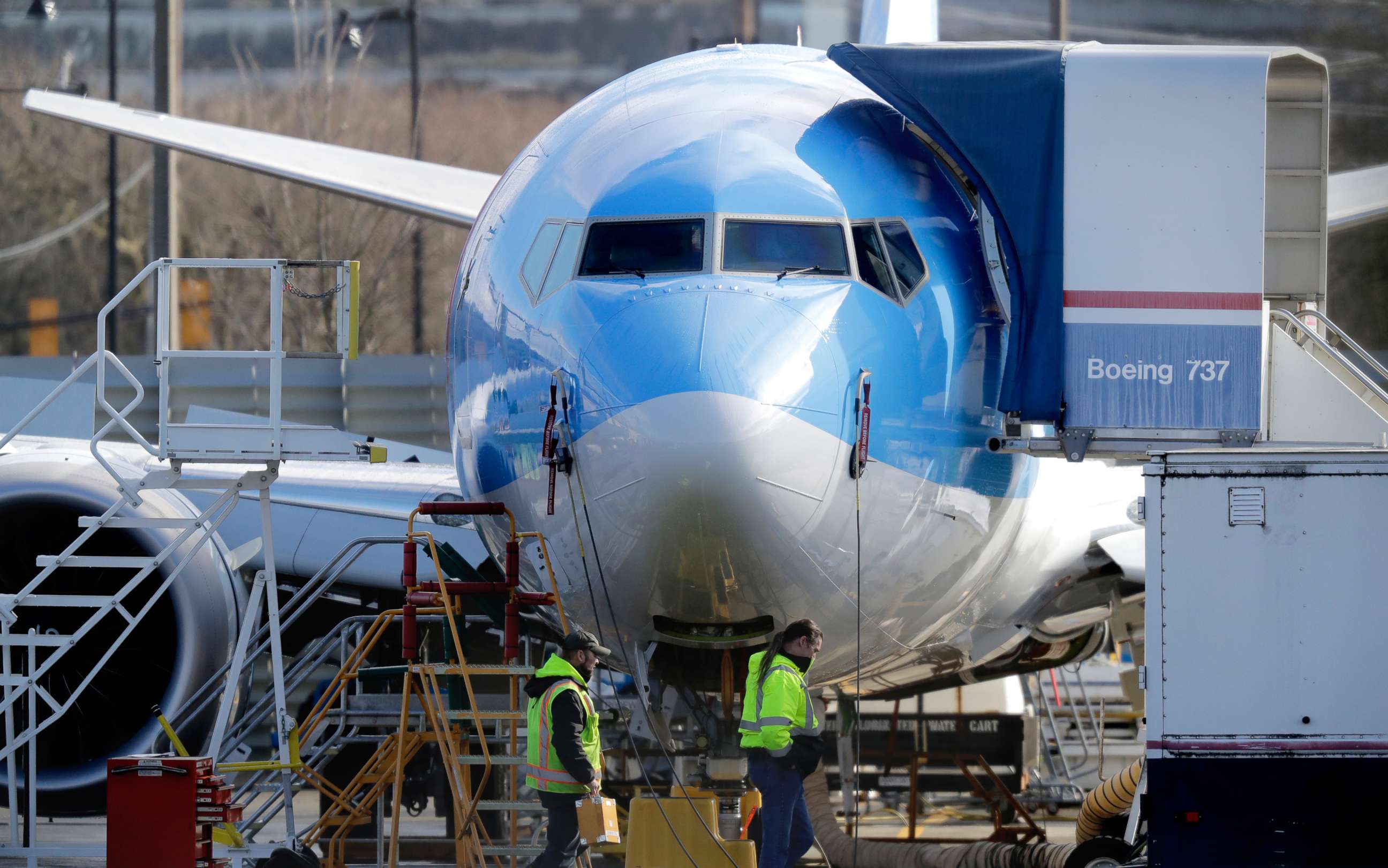 PHOTO: Workers walk past a Boeing 737 MAX 8 airplane being built at Boeing Co.'s Renton Assembly Plant Wednesday, March 13, 2019, in Renton, Wash.