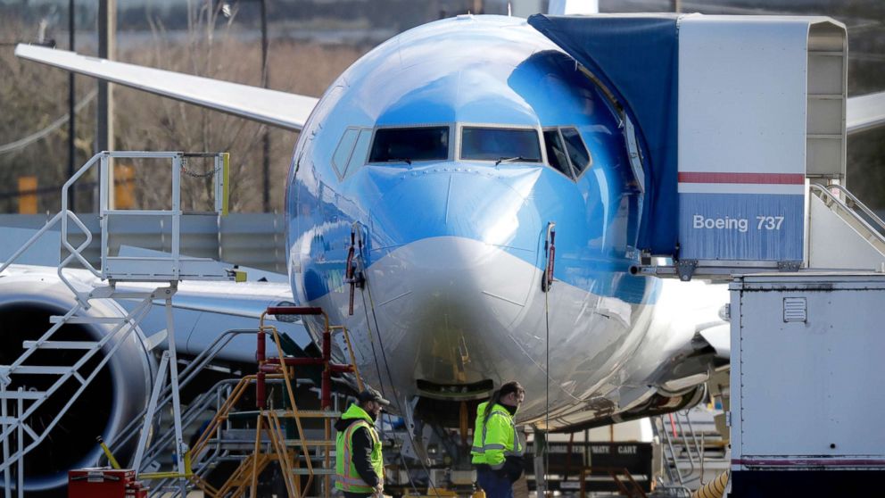PHOTO: Workers walk past a Boeing 737 MAX 8 airplane being built at Boeing Co.'s Renton Assembly Plant Wednesday, March 13, 2019, in Renton, Wash.