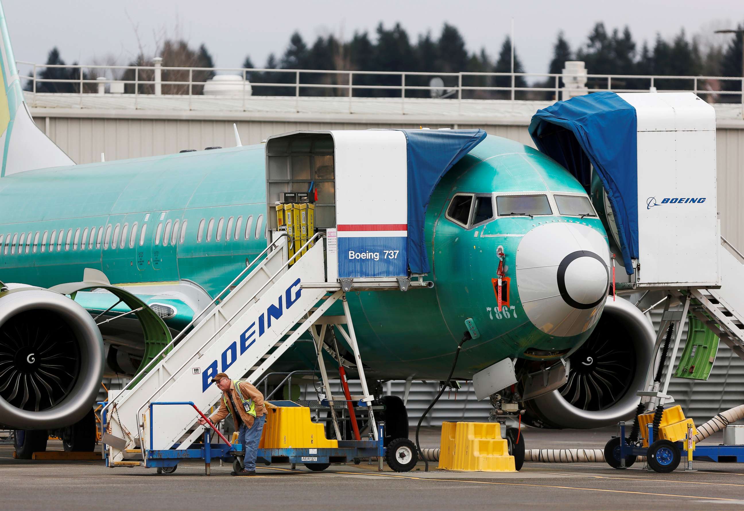PHOTO: An employee works near a Boeing 737 Max aircraft at Boeing's 737 Max production facility in Renton, Wash., on Dec. 16, 2019.