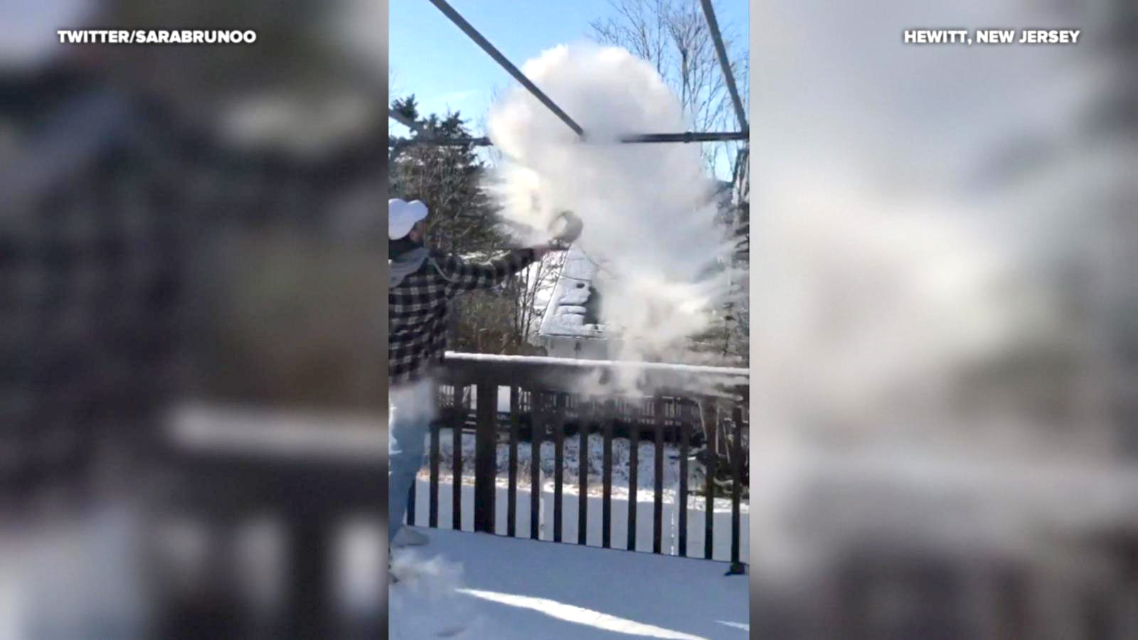 PHOTO:  A daughter burst into laughter as her father surprised himself with a faceful of snow and fell over while attempting a science experiment in freezing temperatures in Hewitt, New Jersey, on December 28, 2017.