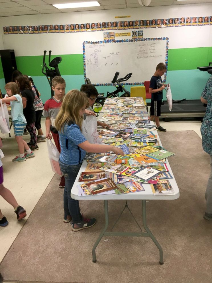 PHOTO: Students picking their books at Free Book Giveaway Day at South Polk Elementary School in May 2018.