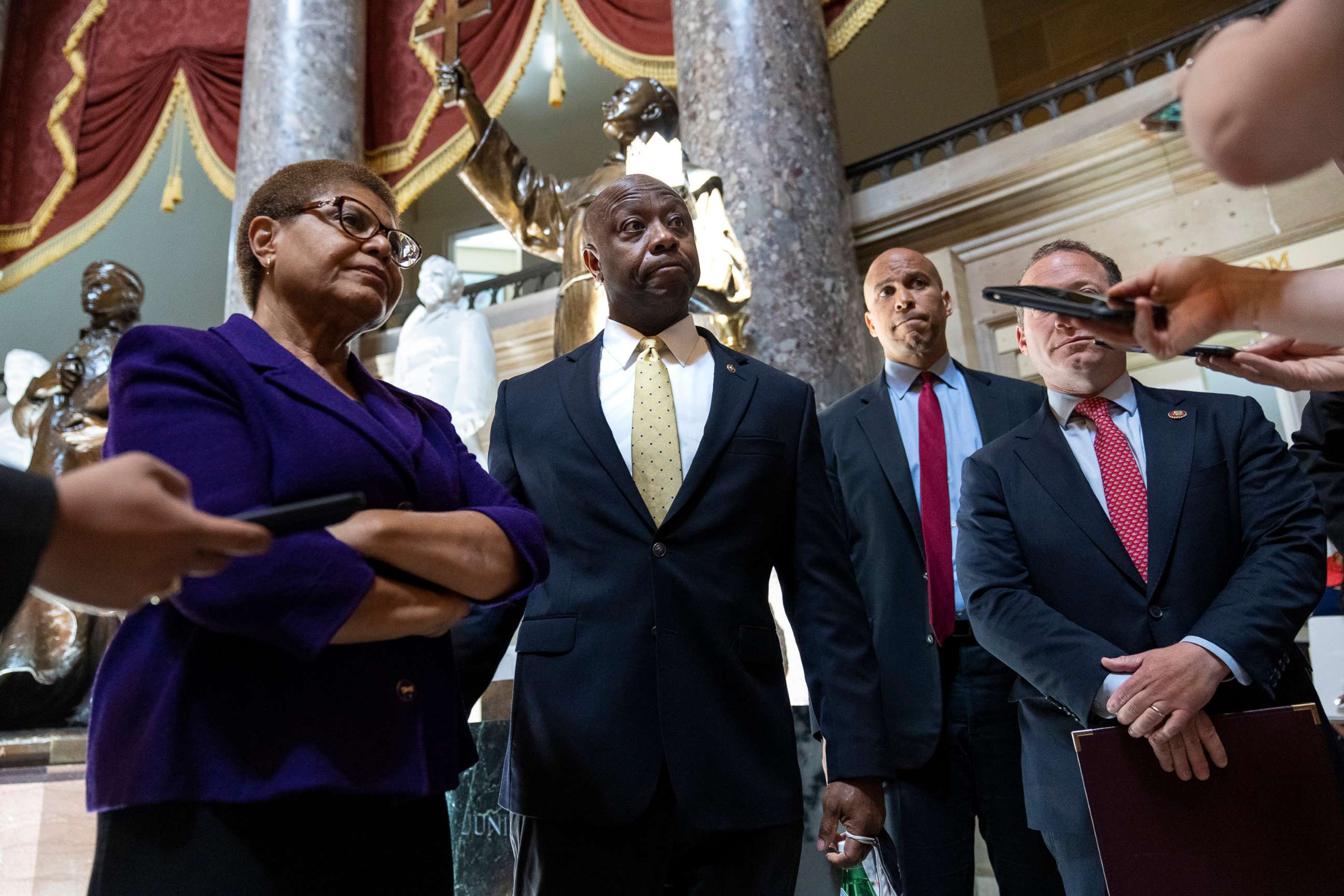 PHOTO: Rep. Karen Bass, Sen. Tim Scott, Sen. Cory Booker, and Rep. Josh Gottheimer speak briefly to reporters following a meeting about police reform legislation on Capitol Hill, May 18, 2021, in Washington.