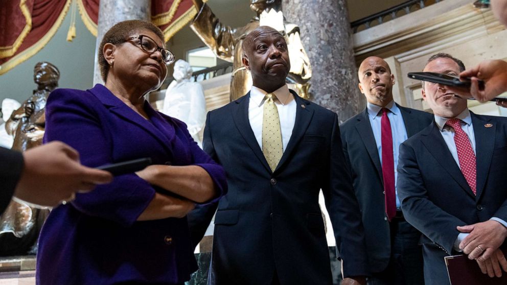 PHOTO: Rep. Karen Bass, Sen. Tim Scott, Sen. Cory Booker, and Rep. Josh Gottheimer speak briefly to reporters following a meeting about police reform legislation on Capitol Hill, May 18, 2021, in Washington.
