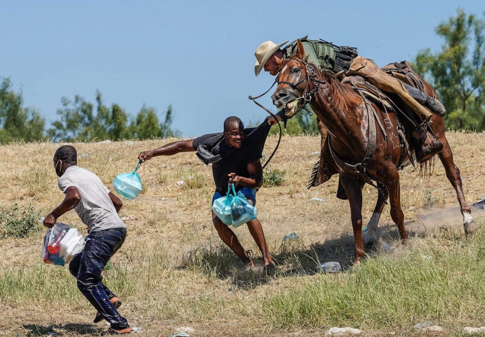 PHOTO: A United States Border Patrol agent on horseback tries to stop a Haitian migrant from entering an encampment on the banks of the Rio Grande near the Acuna Del Rio International Bridge in Del Rio, Texas, Sept. 19, 2021.