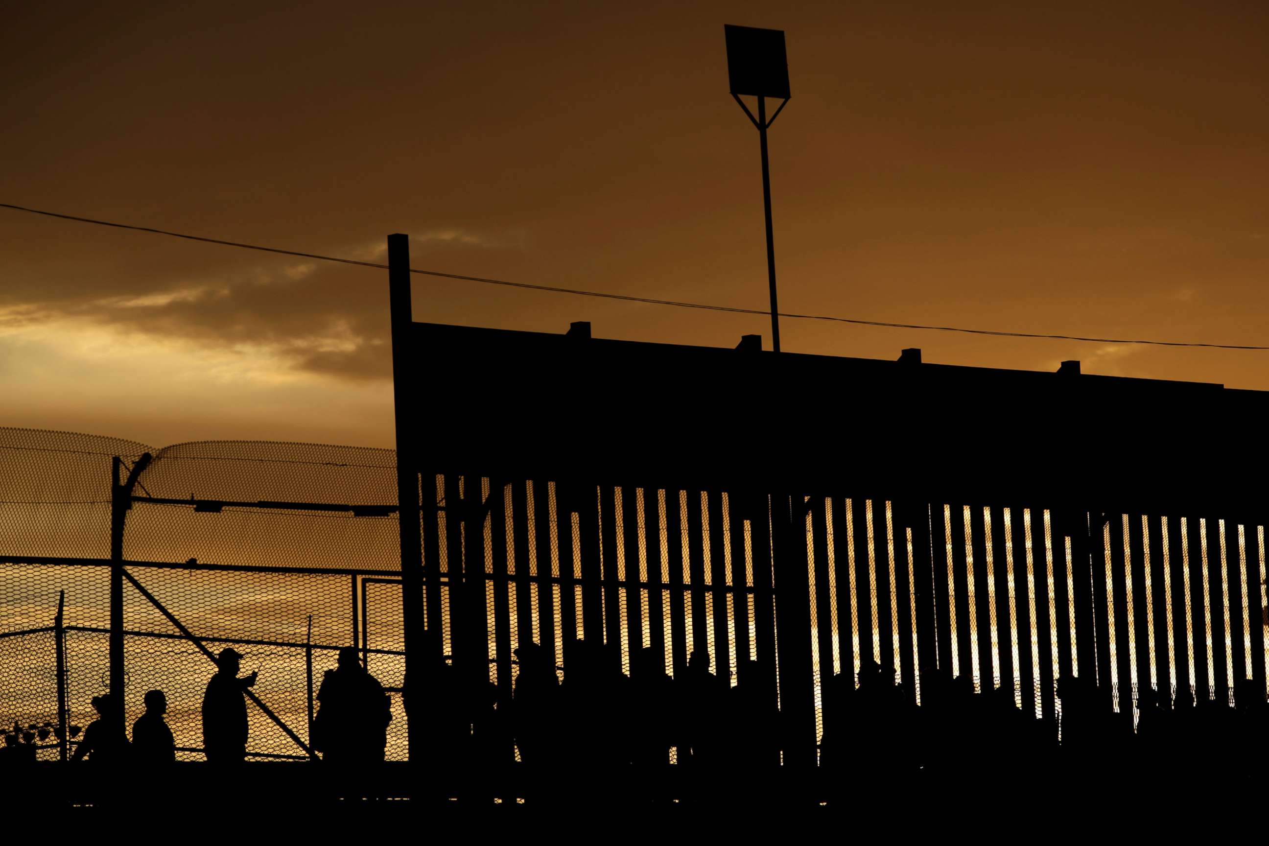 PHOTO: Migrants listen to U.S. Customs and Border Protection officials after crossing illegally into the United States to request asylum in El Paso, Texas, April 5, 2019.