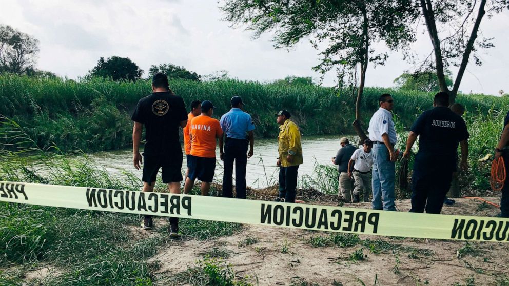 PHOTO: Authorities stand along the Rio Grande bank where the bodies were found, in Matamoros, Mexico, June 24, 2019, after they apparently drowned trying to cross the river to Brownsville, Texas.