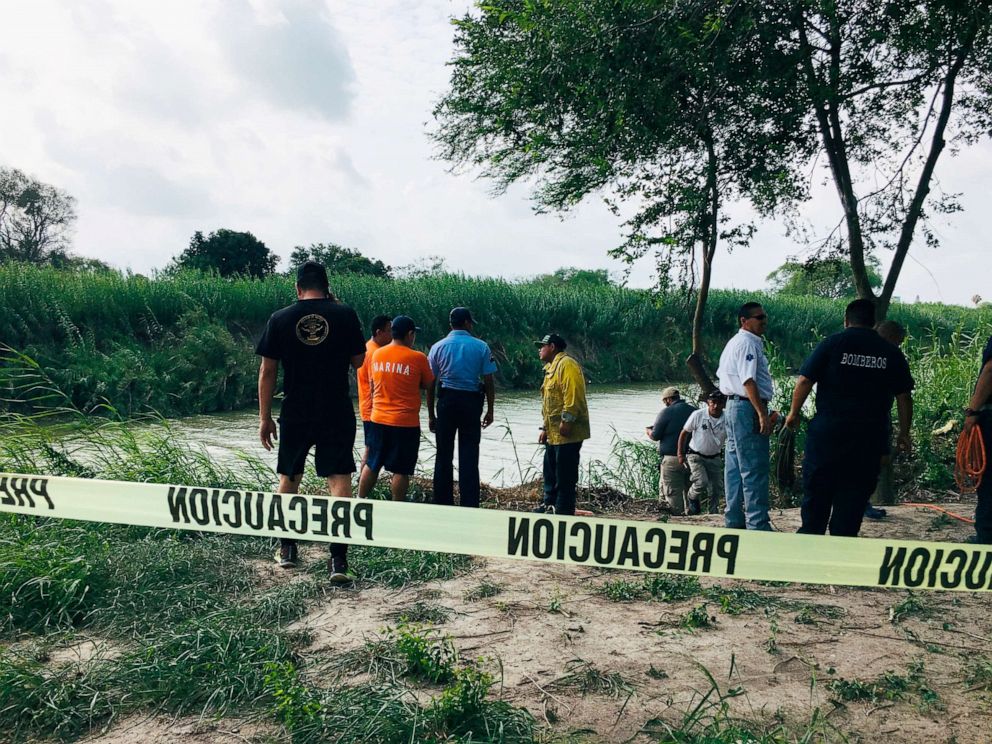 PHOTO: Authorities stand along the Rio Grande bank where the bodies were found, in Matamoros, Mexico, June 24, 2019, after they apparently drowned trying to cross the river to Brownsville, Texas.