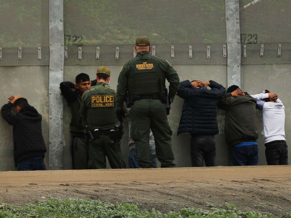 PHOTO: Men surrender to United States Border Patrol agents after jumping a fence in an attempt to get into America, Jan. 17, 2019, in Tijuana, Mexico.