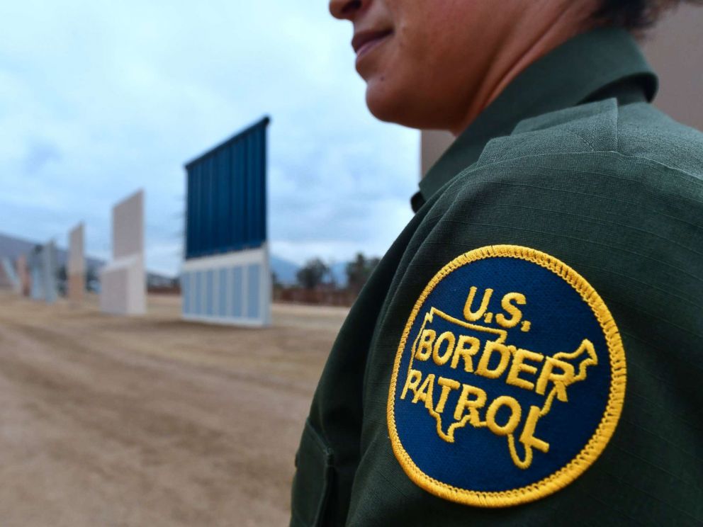 PHOTO: A U.S. Border Patrol officer stands near prototypes of US President Donald Trumps proposed border wall, Nov. 1, 2017, in San Diego, Calif.