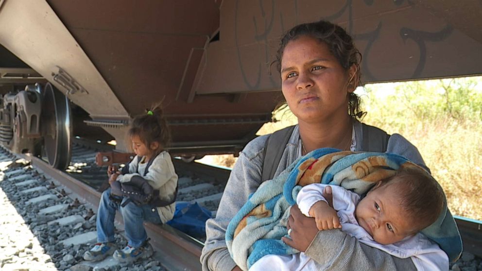 PHOTO: Mildret Paz and her one-month old Melany speaking to ABC near a train they rode north to US-Mexico border.