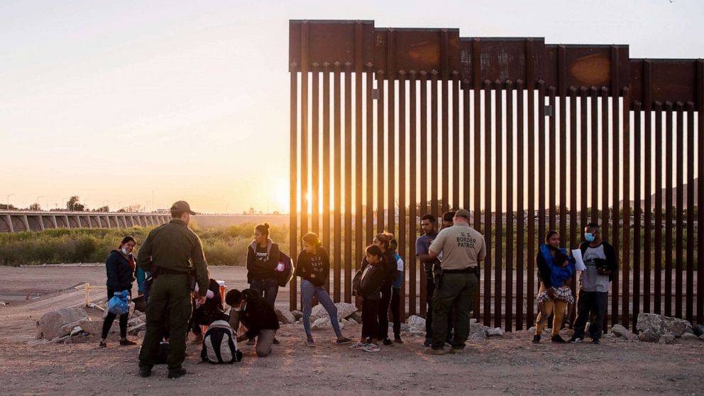 PHOTO: U.S. Border Patrol agents question migrants from Central America in Yuma, Ariz., May 4, 2021.